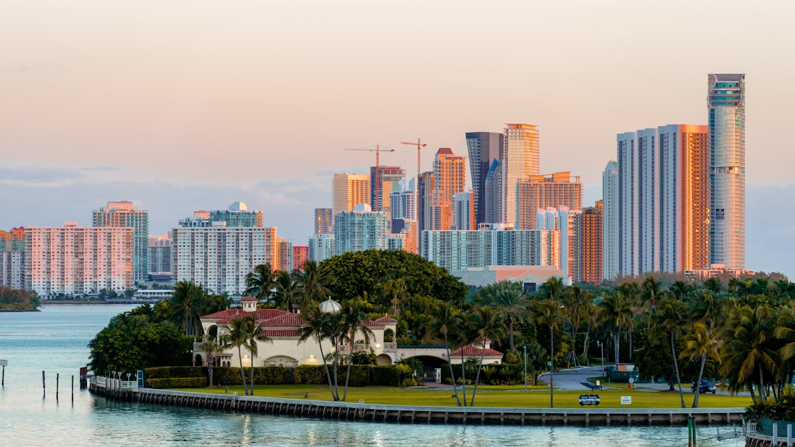 city skyline across body of water during daytime