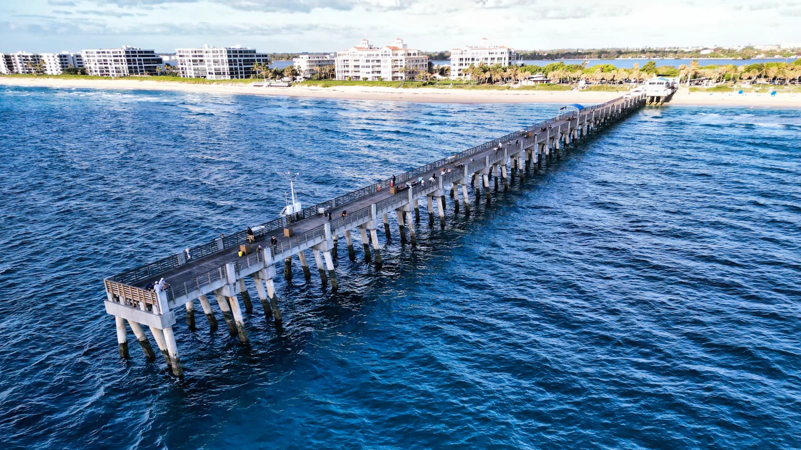 A long pier reaching out over the water on Florida's southeast coast