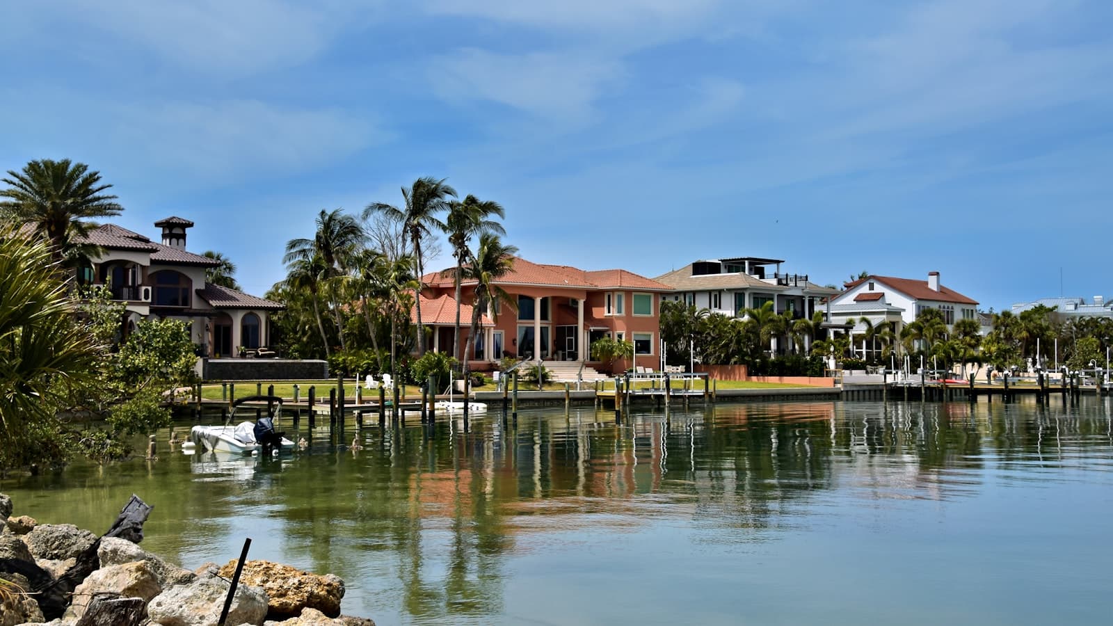 Waterfront houses reflect beautifully in the water.