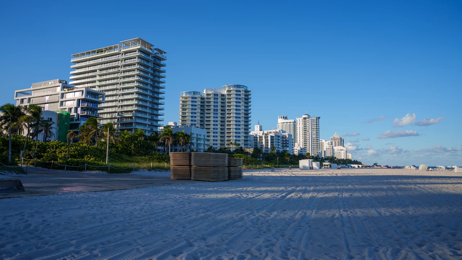 Beach with buildings and clear blue sky